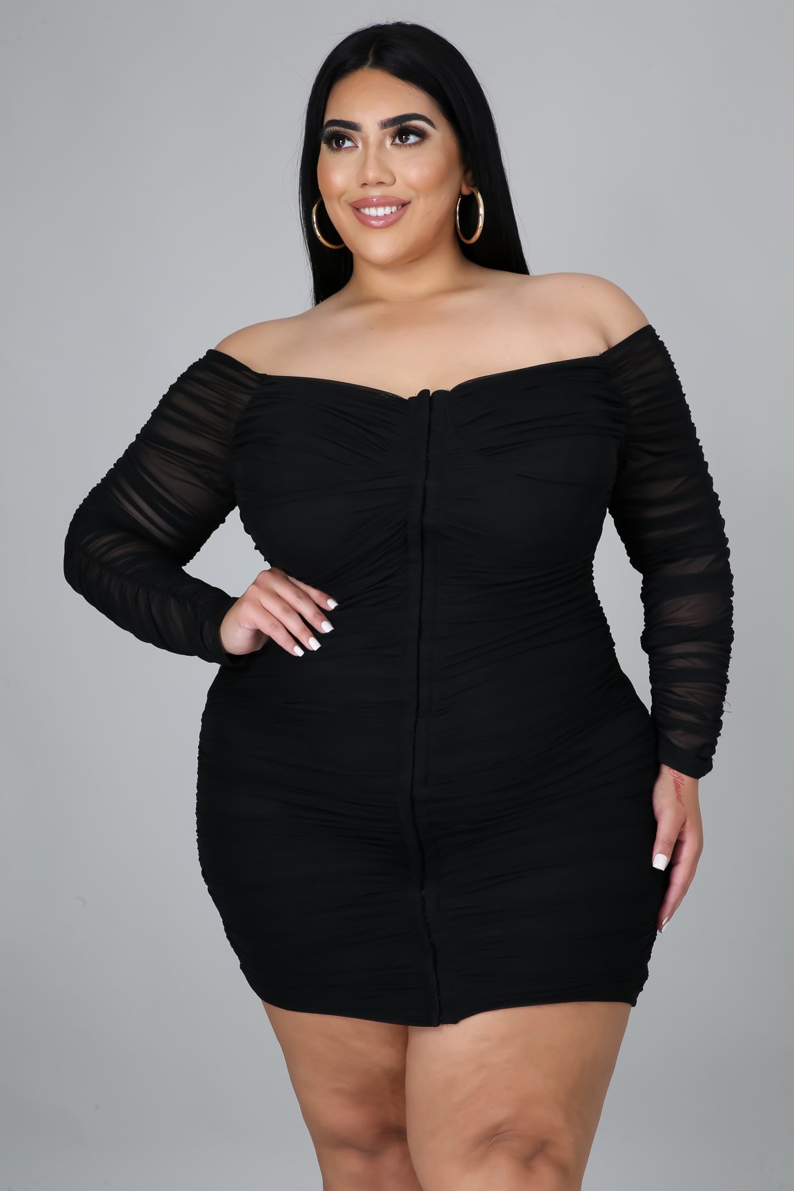 Tonight Im Yours Dress Plus is the perfect black dress, has amazing stretch with a corset style look, with hook closure. Ruched throughout, Long sheer sleeves with a off the shoulder look.
