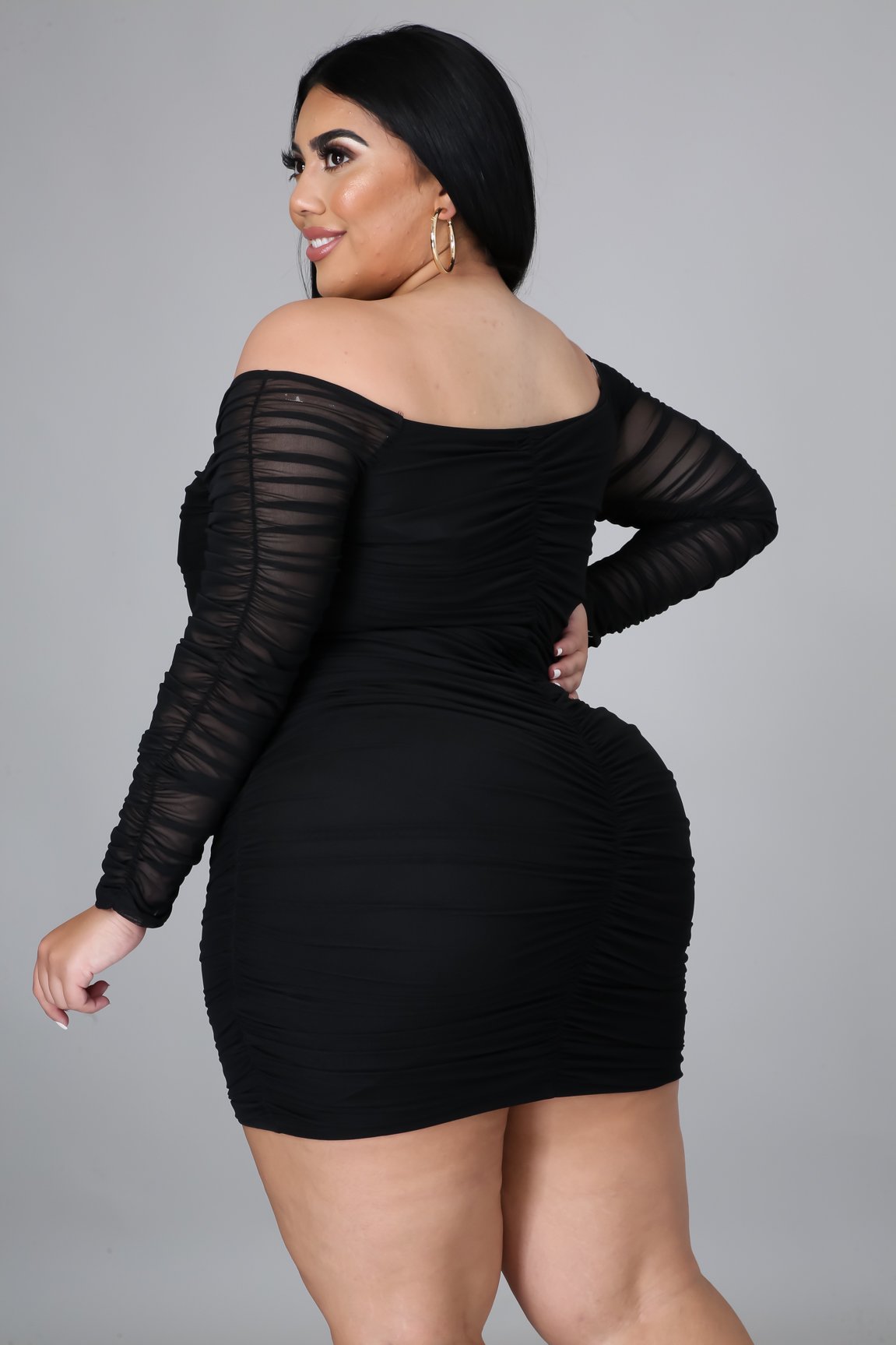 Tonight Im Yours Dress Plus is the perfect black dress, has amazing stretch with a corset style look, with hook closure. Ruched throughout, Long sheer sleeves with a off the shoulder look.