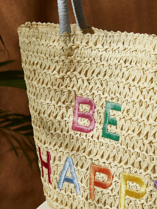 EMBROIDERED "BE HAPPY" STRAW TOTE BAG 