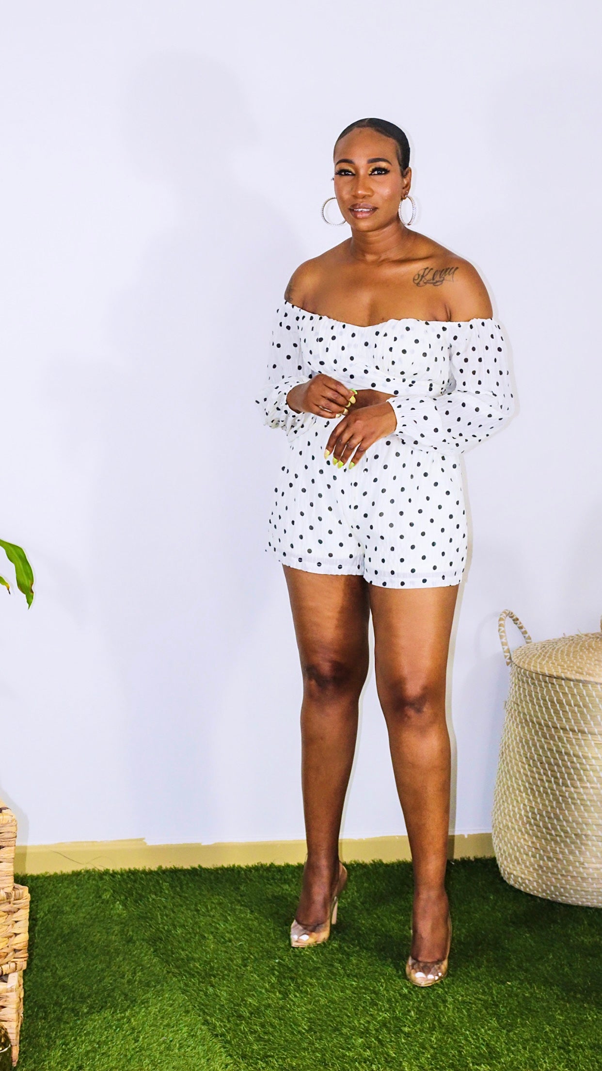 JS Polka Set is a two piece short set with crop top. Top is self tied with padded cups and a off the shoulder look with long sleeves. Shorts are high waisted with elastic waistband and drawstring. Shorts are also lined for extra coverage. 