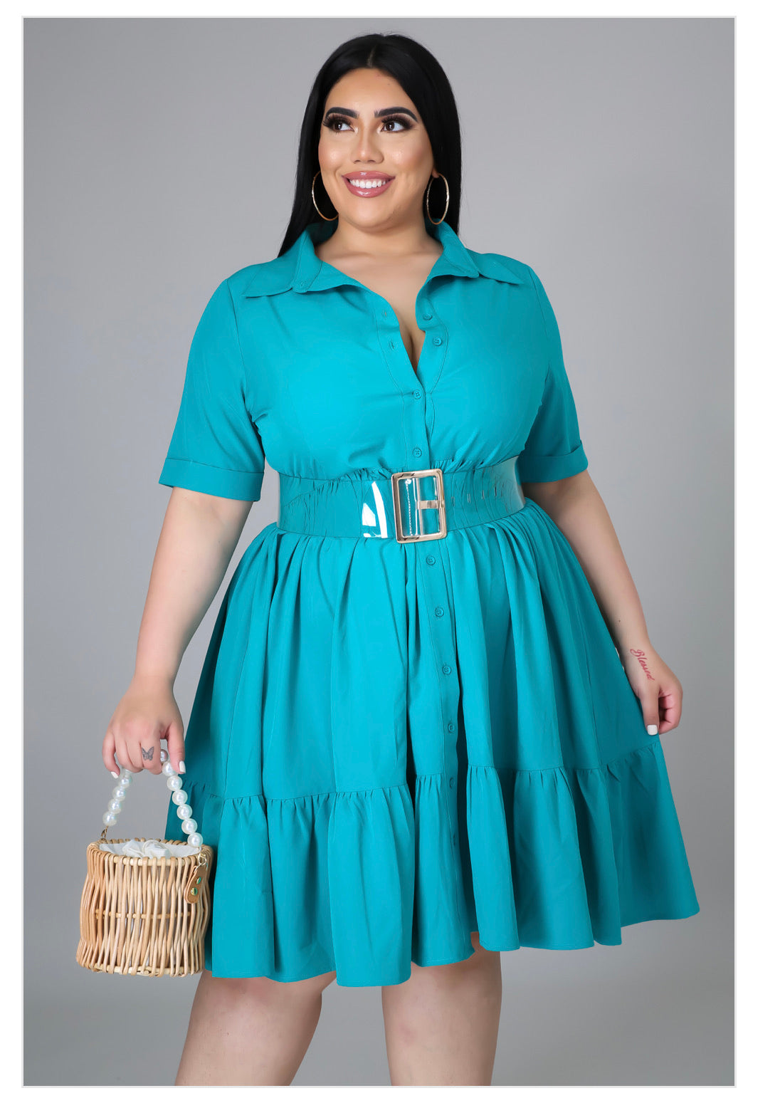 plus size dress. color is jade. button closure, collar at the neck, has sleeves. above the knee. 