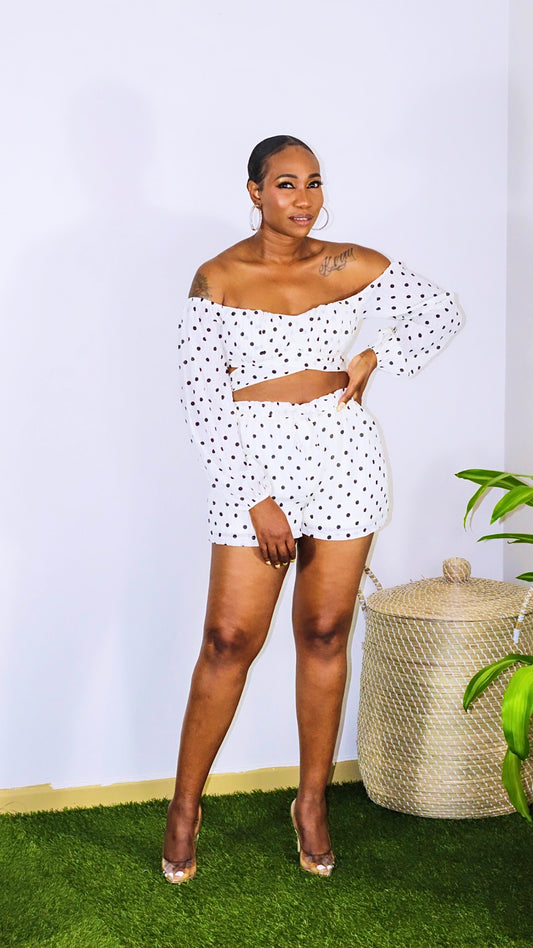 JS Polka Set is a two piece short set with crop top. Top is self tied with padded cups and a off the shoulder look with long sleeves. Shorts are high waisted with elastic waistband and drawstring. Shorts are also lined for extra coverage. 